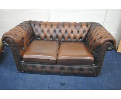 A BROWN LEATHER UPHOLSTERED TWO SEATER CHESTERFIELD SOFA, length 163cm x depth 84cm x height 70cm (condition report: some dis