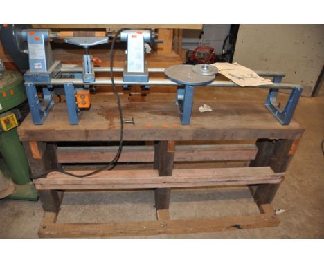 AN ELU DB180 WOODWORKING LATHE mounted to a bespoke pine bench and two face plates bed length 125cm (PAT pass and working)