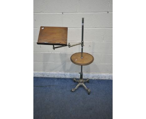 A REPRODUCTION MUSIC STAND, the tubular metal support holding an articulated arm and a fixed circular shelf, raised on a cast
