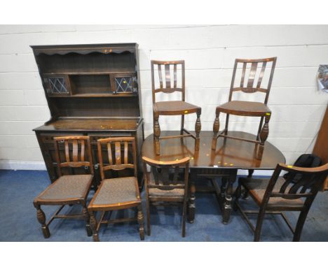 AN EARLY 20TH CENTURY OAK EIGHT PIECE DINING SUITE, comprising a gate leg table, open width 145cm x depth 92cm x height 74cm,