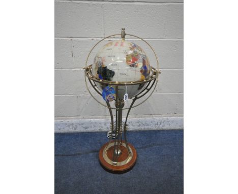A FLOOR STANDING GEMSTONE GLOBE LAMP,  raised on a shaped support and wooden base, height approximately 96cm (condition repor