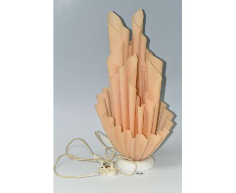 A GEORGIA JACOB 'COROLLE' TABLE LAMP, 1970s, the peach resin shade resembling a flaming torch and raised on a domed marble ba