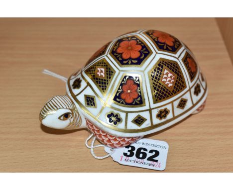 A ROYAL CROWN DERBY 'TURTLE' PAPERWEIGHT, printed with an Imari patterned shell, very light gold stopper, red printed backsta