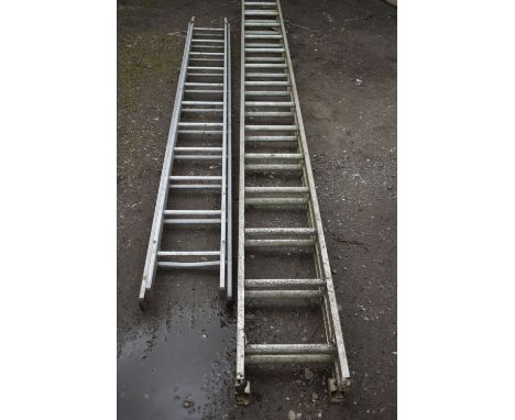A SET OF CLIMA ALUMINIUM DOUBLE EXTENSION LADDERS with 14 rungs to each 375cm section, and a similar smaller double extension