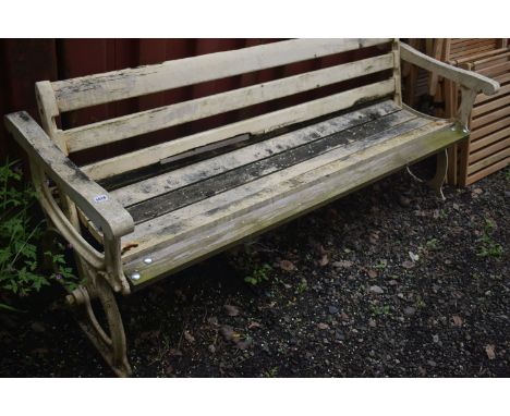 A PAINTED CAST IRON AND TEAK RAILWAY BENCH, with a central pivot that allows backrest to move sides, length 196cm (condition 