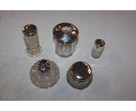A collection of silver topped dressing table jars and bottles 