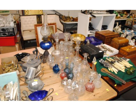 A quantity of various decanters and stoppers, scent bottles etc. to include silver overlaid examples 