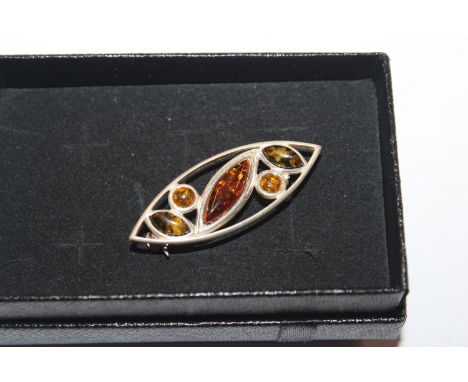 A Sterling silver and amber set brooch 