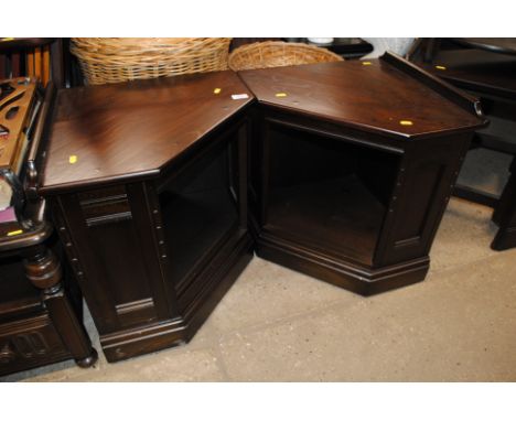 A pair of Ercol corner cupboards 
