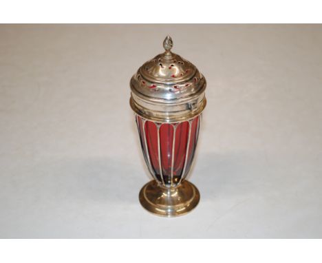 A silver and cranberry glass sugar sifter, marked to base 142 and 144 Jays Oxford Street, approx. total weight lacking glass 