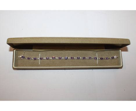 A Sterling silver and amethyst set tennis bracelet
