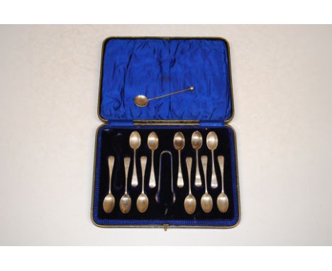 A part cased set of silver teaspoons and sugar tongs, 144gms; and an white metal spoon