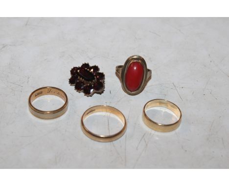 Two 9ct gold wedding bands, 4.5gms; a yellow metal ring marked 585, 3.5gms; a yellow metal ring stamped 333 set with coloured