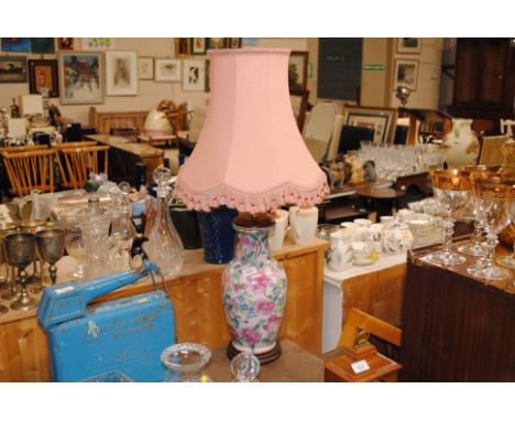 An Oriental style floral decorated table lamp and shade 
