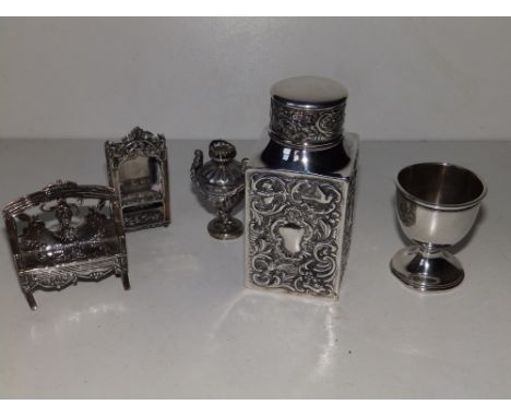 A small embossed square silver tea caddy - Goldsmiths &amp; Silversmiths, London 1900,  4" high, two damaged pieces of miniat