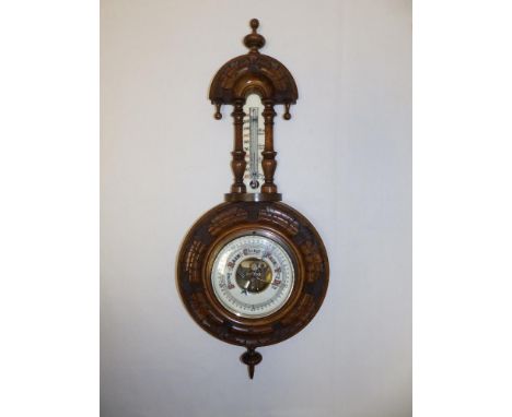 A small Victorian banjo barometer with enamelled dials. 18" high.