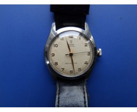 A gent's stainless steel Tudor Oyster 7803 wrist watch  with cream dial,  gold arabic numerals, on replacement leather strap.