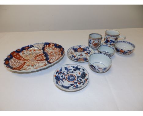 Three 18th/19thC Oriental Imari coloured tea bowls, two cups, two saucers and a Japanese Imari 8.6" oval dish. (8)