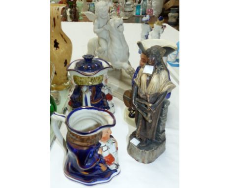 An Allerton's lustre Toby jug teapot (lip chipped) and matching milk jug; a 19th century Paragon group, cherub riding a lion,