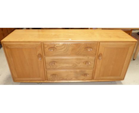 A modern Ercol light elm sideboard of 2 cupboards and 3 central drawers