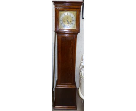 A reproduction oak cased longcase clock with brass dial and chiming spring driven movement