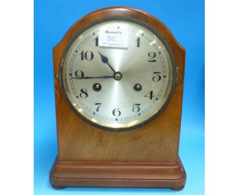A 1920's mahogany cased striking mantel clock; a circular cased aneroid barometer