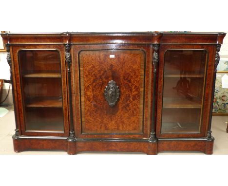 A mid Victorian amboyna credenza of break front form, with rosewood crossbanding, ebonised mouldings and vulcanite mounts, co