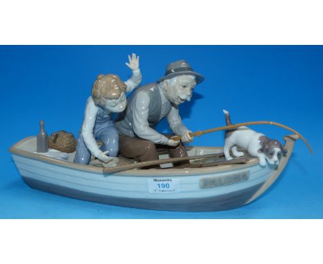 A Lladro figure group with fisherman and child in a boat, 15"