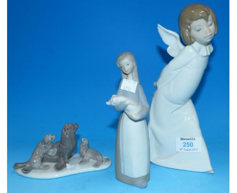 Three Lladro figures:  angel; girl with piglet, and 3 seals