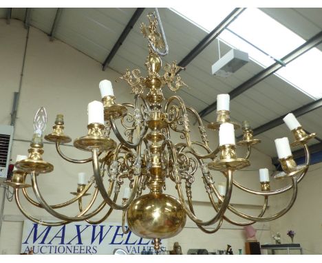 A large Cromwellian style brass chandelier fitting with lower tier of 12 and upper tier of 6 branches