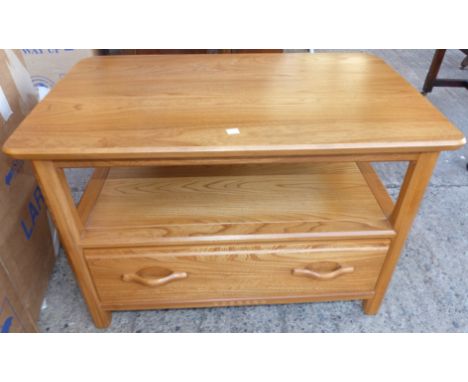 A modern Ercol light elm occasional table with drawer under and side flaps