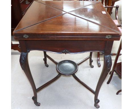 An Edwardian mahogany envelope card table, carved cabriole legs with saltire stretchers, 22"