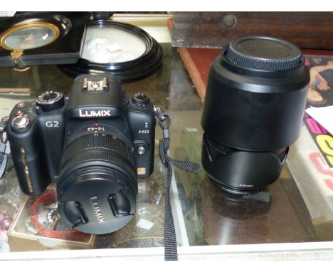 A digital camera with 14-42 mm and 45-200 mm lenses