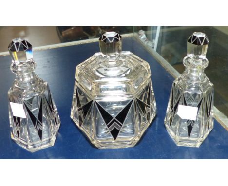 An Art Deco 3 piece black overlaid trinket set comprising covered trinket jar and 2 scent bottles (minor chips to trinket jar