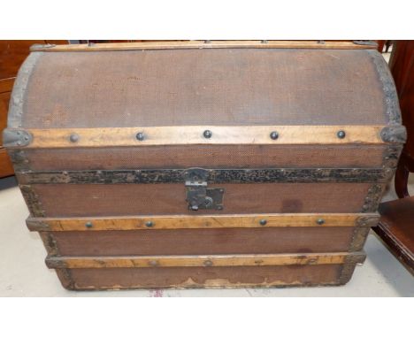 A Victorian metal bound domed top trunk
