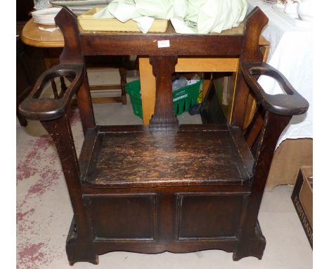 An oak box seat hall settle/stick stand