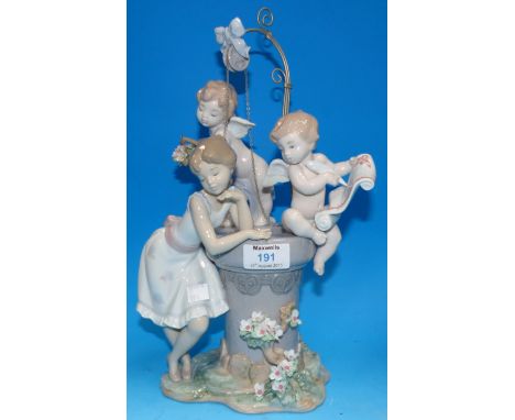 A Lladro limited edition figure of a young girl with cupids at a wishing well, 14"