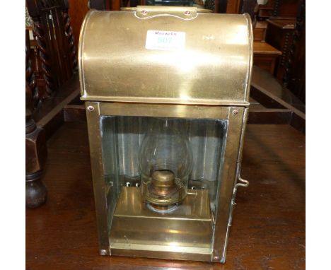 A brass carriage lamp; a pair of pewter railway candlesticks, monogrammed "GER"