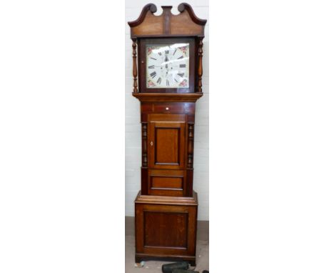 An early 19th century oak and mahogany longcase clock with swan neck pediment and turned columns to the hood, similar columns