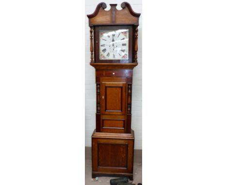 An early 19th century oak and mahogany longcase clock with swan neck pediment and turned columns to the hood, similar columns