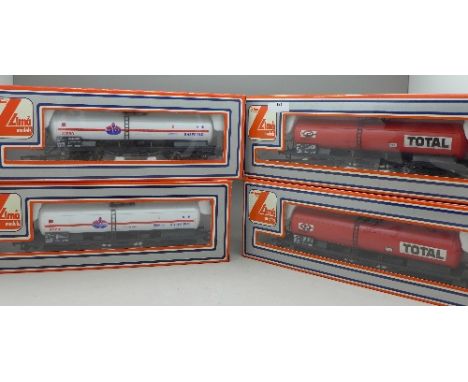 Four Lima OO scale model train wagons, two Total and two Amoco, boxed