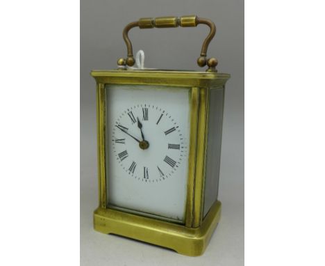 A French brass four-glass sided carriage clock and key