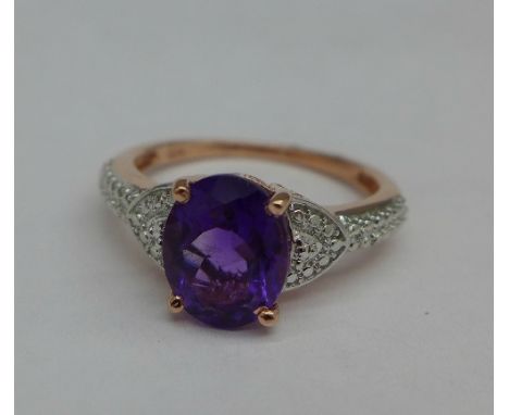 A silver gilt and amethyst ring, Q