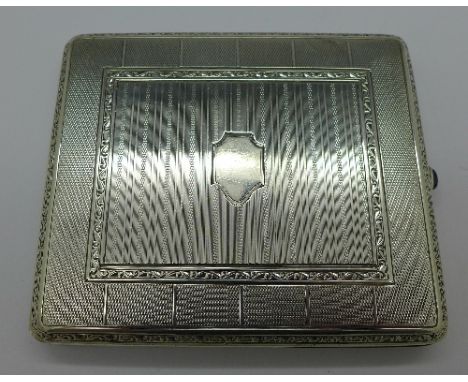 A sterling silver cigarette case with cabochon button stamped U.K.A., .935, 146.8g