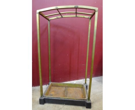 A brass and cast iron Art Deco stick stand