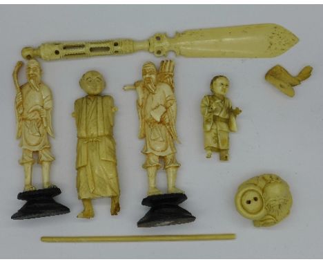 Carved figures,  netsuke and a letter opener