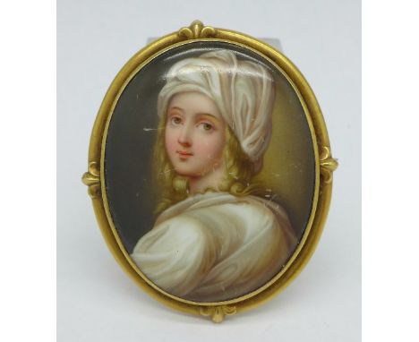 A yellow set portrait miniature on porcelain brooch/pendant, tests as gold, width 5cm