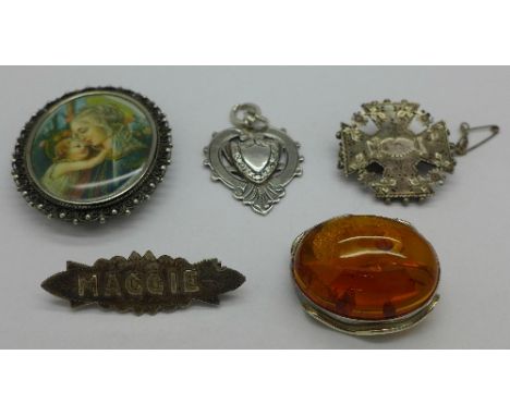 Two Victorian silver brooches including 'Maggie', a portrait brooch, an amber set brooch and a silver fob