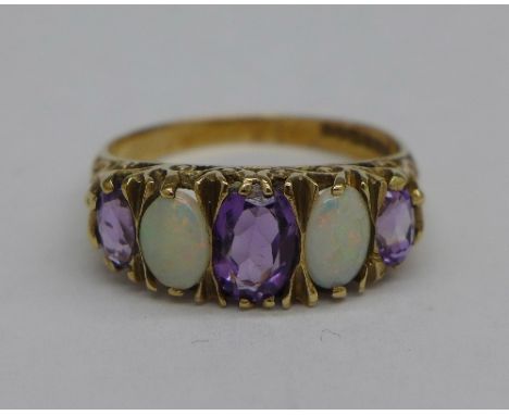 A 9ct gold, opal and amethyst ring, 3.2g, Q