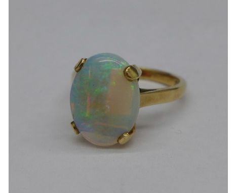 A 9ct gold and opal ring, 3.3g, M, 13mm x 10mm opal